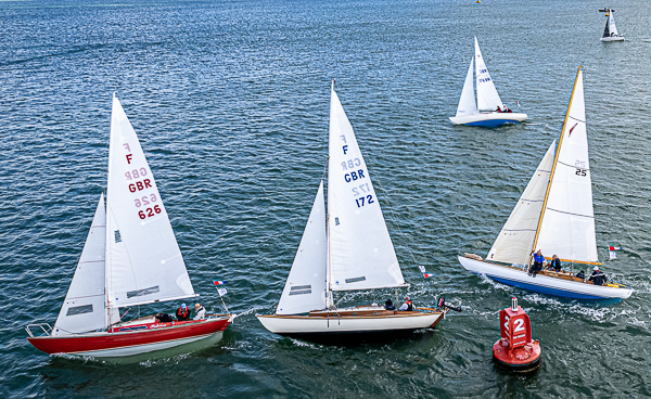 Cowes Classics Week - Class three, Folkboats chased by Tumlare 'Zest'.
